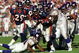 31 Oct 1999: Olandis Gary #22 of the Denver Broncos carries the ball as he is tackled during a game against the Minnesota Vikings at the Mile High Stadium in Denver, Colorado. The Vikings defeated the Broncos 23-20. Mandatory Credit: Rodolfo Ganzales  /Allsport