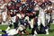 31 Oct 1999: Olandis Gary #22 of the Denver Broncos carries the ball as he is tackled during a game against the Minnesota Vikings at the Mile High Stadium in Denver, Colorado. The Vikings defeated the Broncos 23-20. Mandatory Credit: Rodolfo Ganzales  /Allsport