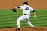NEW YORK - MAY 04:  Phil Hughes #65 of the New York Yankees pitches against the Boston Red Sox on May 4, 2009 at Yankee Stadium in the Bronx borough of New York City. The Red Sox defeated the Yankees 6-4  (Photo by Jim McIsaac/Getty Images)