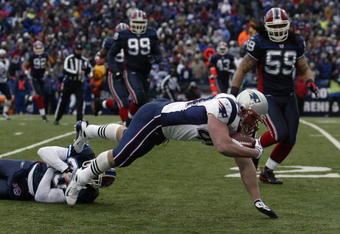ORCHARD PARK, NY - DECEMBER 28:  Heath Evans #44 of the New England Patriots dives for extra yardage during the game against the Buffalo Bills on December 28, 2008 at Ralph Wilson Stadium in Orchard Park, New York. (Photo by Rick Stewart/Getty Images)