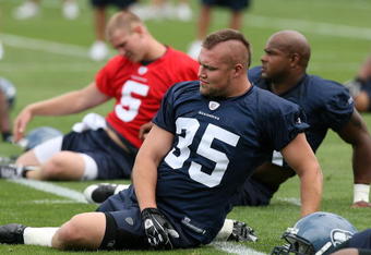 KIRKLAND, WA - JULY 25: Fullback Owen Schmitt #35 of the Seattle Seahawks stretches during training camp at the team's training facility on July 25, 2008 in Kirkland, Washington. (Photo by Otto Greule Jr/Getty Images)