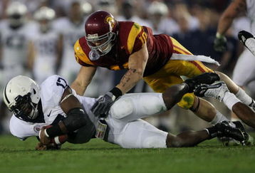 PASADENA, CA - JANUARY 01:  Quarterback Daryll Clark #17 of the Penn State Nittany Lions falls on the ball under pressure from Brian Cushing #10 of the USC Trojans during the 95th Rose Bowl Game presented by Citi on January 1, 2009 at the Rose Bowl in Pasadena, California.  (Photo by Stephen Dunn/Getty Images)
