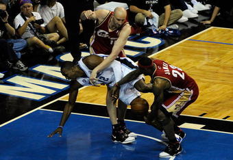 ORLANDO, FL - MAY 24:  LeBron James #23 of the Cleveland Cavaliers steals the ball from Dwight Howard #12 of the Orlando Magic in Game Three of the Eastern Conference Finals during the 2009 NBA Playoffs at the the Amway Arena on May 24, 2009 in Orlando, Florida. NOTE TO USER: User expressly acknowledges and agrees that, by downloading and or using this photograph, User is consenting to the terms and conditions of the Getty Images License Agreement.  (Photo by Sam Greenwood/Getty Images)