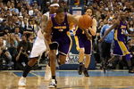 DENVER - MAY 23:  Trevor Ariza #3 of the Los Angeles Lakers is fouled by Carmelo Anthony #15 of the Denver Nuggets after Ariza stole the ball late in the fourth quarter in Game Three of the Western Conference Finals during the 2009 NBA Playoffs at Staples Center on May 23, 2009 in Denver, Colorado. NOTE TO USER: User expressly acknowledges and agrees that, by downloading and or using this photograph, User is consenting to the terms and conditions of the Getty Images License Agreement.  (Photo by Jed Jacobsohn/Getty Images)