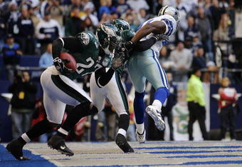 DALLAS - DECEMBER 16:  Safety Quintin Mikell #27 of the Philadelphia Eagles intercepts a pass intended for wide receiver Terrell Owens #81 of the Dallas Cowboys in the first half at Texas Stadium December 16, 2007 in Dallas, Texas.  The Eagles won 10-6.  (Photo by Brian Bahr/Getty Images)