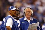 INDIANAPOLIS - NOVEMBER 16:  Payton Manning #18 of the Indianapolis Colts talks over a play with Head Coach Tony Dungy and Offensive Coordinator Tom Moore during the second quarter against the Houston Texans at Lucas Oil Stadium on November 16, 2008 in Indianapolis, Indiana.  (Photo by Harry How/Getty Images)