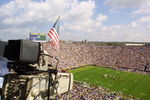 22 Sep 2001:  A flag is hung from a TV camera to remember the victims of the recent attacks as the University of Michigan Wolverines play against the Western Michigan Broncos at Michigan Stadium (The Big House) in Ann Arbor, Michigan.  Michigan beat Western Michigan 38-21.  DIGITAL IMAGE Mandatory Credit: Danny Moloshok/ALLSPORT