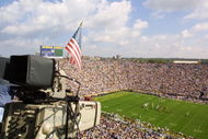 22 Sep 2001: A flag is hung from a TV camera to remember the victims of the recent attacks as the University of Michigan Wolverines play against the Western Michigan Broncos at Michigan Stadium (The Big House) in Ann Arbor, Michigan. Michigan beat Western Michigan 38-21. DIGITAL IMAGE Mandatory Credit: Danny Moloshok/ALLSPORT