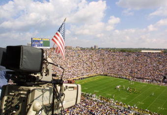 22 Sep 2001:  A flag is hung from a TV camera to remember the victims of the recent attacks as the University of Michigan Wolverines play against the Western Michigan Broncos at Michigan Stadium (The Big House) in Ann Arbor, Michigan.  Michigan beat Western Michigan 38-21.  DIGITAL IMAGE Mandatory Credit: Danny Moloshok/ALLSPORT