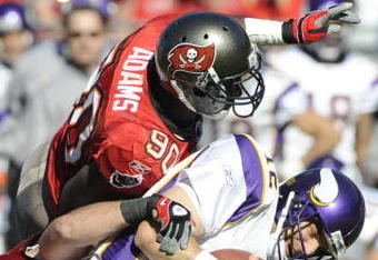 TAMPA, FL - NOVEMBER 16: Defensive end Gaines Adams #90 of the Tampa Bay Buccaneers sacks quarterback Gus Frerotte #12 of the Minnesota Vikings at Raymond James Stadium on November 16, 2008 in Tampa, Florida.  (Photo by Al Messerschmidt/Getty Images) 