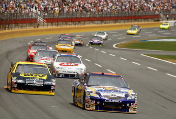 CONCORD, NC - MAY 25:  David Reutimann, driver of the #00 Aaron's Dream Machine Toyota, leads a group of cars during the NASCAR Sprint Cup Series Coca-Cola 600 on May 25, 2009 at Lowe's Motor Speedway in Concord, North Carolina.  (Photo by Streeter Lecka/Getty Images)