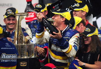 CONCORD, NC - MAY 25:  David Reutimann, driver of the #00 Aaron's Dream Machine Toyota, celebrates in victory lane after winning the NASCAR Sprint Cup Series Coca-Cola 600 on May 25, 2009 at Lowe's Motor Speedway in Concord, North Carolina. Reutimann won the Coca-Cola 600 due to a rain out on lap 227.  (Photo by Rusty Jarrett/Getty Images for NASCAR)