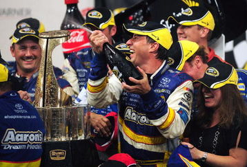 CONCORD, NC - MAY 25:  David Reutimann, driver of the #00 Aaron's Dream Machine Toyota, celebrates in victory lane after winning the NASCAR Sprint Cup Series Coca-Cola 600 on May 25, 2009 at Lowe's Motor Speedway in Concord, North Carolina. Reutimann won the Coca-Cola 600 due to a rain out on lap 227.  (Photo by Rusty Jarrett/Getty Images for NASCAR)