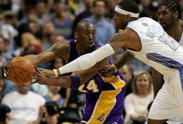 DENVER - MAY 23:  Kobe Bryant #24 of the Los Angeles Lakers looks to pass the ball around Carmelo Anthony #15 and Nene #31 of the Denver Nuggets in Game Three of the Western Conference Finals during the 2009 NBA Playoffs at Staples Center on May 23, 2009 in Denver, Colorado. NOTE TO USER: User expressly acknowledges and agrees that, by downloading and or using this photograph, User is consenting to the terms and conditions of the Getty Images License Agreement.  (Photo by Jed Jacobsohn/Getty Images)