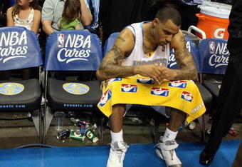 DENVER - MAY 23:  Kenyon Martin #4 of the Denver Nuggets sits on the bench after losing to the Los Angeles Lakers 103-97 in Game Three of the Western Conference Finals during the 2009 NBA Playoffs at Staples Center on May 23, 2009 in Denver, Colorado. NOTE TO USER: User expressly acknowledges and agrees that, by downloading and or using this photograph, User is consenting to the terms and conditions of the Getty Images License Agreement.  (Photo by Jed Jacobsohn/Getty Images)