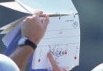7 Aug 2000:  The New England Patriots go over their stategy from the playbook during the Patriots Training Camp at Bryant College in Smithfield, Rhode Island.Mandatory Credit: Jamie Squire  /Allsport