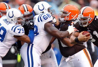 CLEVELAND - NOVEMBER 30:  Jamal Lewis #31 of the Cleveland Browns runs witht he ball against Raheem Brock #79 and Eric Foster #68 of the Indianapolis Colts during their NFL game on November 30, 2008 at Cleveland Browns Stadium in Cleveland, Ohio. The Colts defeated the Browns 10-6.  (Photo by Gregory Shamus/Getty Images)