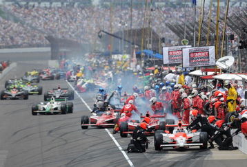 INDIANAPOLIS - MAY 24:  Helio Castroneves driver of the #3 Team Penske Dallara Honda leads the field in the pits during the IRL IndyCar Series 93rd running of the Indianapolis 500 at the Indianapolis Motor Speedway on May 24, 2009 in Indianapolis, Indiana.  (Photo by Robert Laberge/Getty Images)