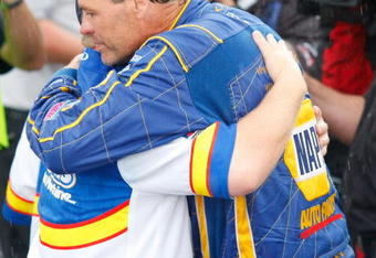 CONCORD, NC - MAY 25: Car owner Michael Waltrip hugs a crew member after David Reutimann (not pictured), driver of the #00 Aaron's Dream Machine Toyota was declared the winner of the NASCAR Sprint Cup Series Coca-Cola 600 on May 25, 2009 at Lowe's Motor Speedway in Concord, North Carolina. Reutimann won the Coca-Cola 600 due to a rain out on lap 227. (Photo by Geoff Burke/Getty Images for NASCAR)