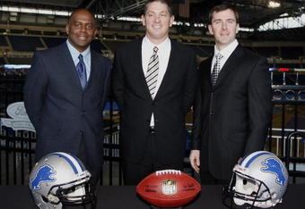 DETROIT , MI - JANUARY 16:  Jim Schwartz, center, head coach of the Detroit Lions poses with General Manager Martin Mayhew, left, and Tom Lewand team president after a press conference to introduce him as the Lions new head coach on January 16, 2009 at Ford Field in Detroit, Michigan.  (Photo by Gregory Shamus/Getty Images)