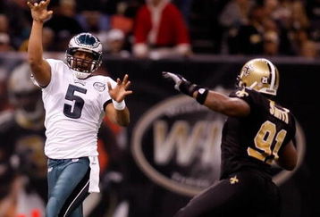 NEW ORLEANS - DECEMBER 23:  Donovan McNabb #5 of the Philadelphia Eagles throws a pass over Will Smnith #91 of the New Orleans Saints on December 23, 2007 at the Louisiana Superdome in New Orleans, Louisiana.  (Photo by Chris Graythen/Getty Images)
