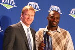 TAMPA, FL - FEBRUARY 02:  Santonio Holmes of the Pittsburgh Steelers (R) holds the Super Bowl XLIII Most Valuable Player Award with NLF Commisioner Roger Goodell during the Post Super Bowl XLIII Coach's Press Conference  on February 2, 2009 in Tampa, Florida.  (Photo by Al Bello/Getty Images)