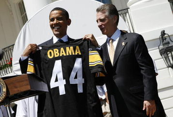 WASHINGTON  - MAY 21:  U.S. President Barack Obama (L) holds up a jersey as Pittsburgh Steelers as President Art Rooney II (3rd R), looks on at the South Portico of White House May 21, 2009 in Washington, DC. The Steelers deafeated the Arizona Cardinals in Super Bowl XLIII.   (Photo by Aude Guerrucci-Pool/Getty Images)