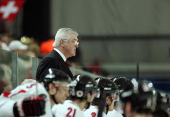 TURIN, ITALY - FEBRUARY 18:  Head coach Pat Quinn of Canada watches the game from the bench during the men's ice hockey Preliminary Round Group A match against Switzerland during Day 8 of the Turin 2006 Winter Olympic Games on February 18, 2006 at the Torino Esposizioni in Turin, Italy.  (Photo by Elsa/Getty Images)