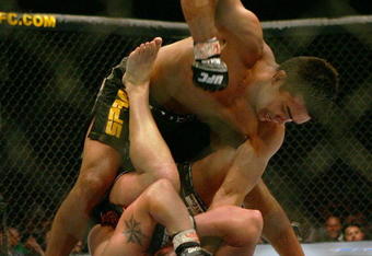 MANCHESTER, UNITED KINGDOM - APRIL 21: Lyoto Machida of Brazil and David Heath of England in action during a Welterweight bout of the Ultimate Fighting Championship at the Manchester Evening News Arena on April 21, 2007 in Manchester, England. (Photo by Gary M. Prior/Getty Images).