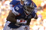 New York Giants running back Tiki Barber rushes upfield for a pass  Feb. 10, 2007 at  the 2007 Pro Bowl at Kapolei, Hawaii.  (Photo by Al Messerschmidt/Getty Images)