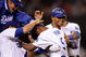 LOS ANGELES, CA - MAY 23:  Juan Pierre #9 (C) of the Los Angeles Dodgers is congratulated by pitcher Clayton Kershaw (L) catcher Russell Martin (2L) and Matt Kemp #27 who scored the winning run after a bases loaded walk to Pierre to defeat the Los Angeles Angels of Anaheim, 5-4, during the tenth inning of the baseball game at Dodger Stadium on May 23, 2009 in Los Angeles, California.  (Photo by Kevork Djansezian/Getty Images)