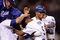 LOS ANGELES, CA - MAY 23:  Juan Pierre #9 (C) of the Los Angeles Dodgers is congratulated by pitcher Clayton Kershaw (L) catcher Russell Martin (2L) and Matt Kemp #27 who scored the winning run after a bases loaded walk to Pierre to defeat the Los Angeles Angels of Anaheim, 5-4, during the tenth inning of the baseball game at Dodger Stadium on May 23, 2009 in Los Angeles, California.  (Photo by Kevork Djansezian/Getty Images)