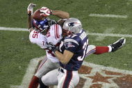 GLENDALE, AZ - FEBRUARY 03:  David Tyree #85 of the New York Giants catches a 32-yard pass from Eli Manning #10 as Rodney Harrison #37 of the New England Patriots attempts to knock it out in the fourth quarter of Super Bowl XLII on February 3, 2008 at the University of Phoenix Stadium in Glendale, Arizona. The Giants defeated the Patriots 17-14.  (Photo by Doug Pensinger/Getty Images)