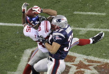 GLENDALE, AZ - FEBRUARY 03:  David Tyree #85 of the New York Giants catches a 32-yard pass from Eli Manning #10 as Rodney Harrison #37 of the New England Patriots attempts to knock it out in the fourth quarter of Super Bowl XLII on February 3, 2008 at the University of Phoenix Stadium in Glendale, Arizona. The Giants defeated the Patriots 17-14.  (Photo by Doug Pensinger/Getty Images)