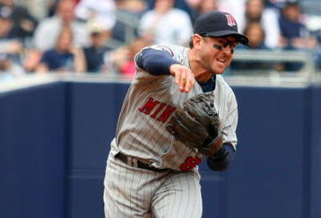 NEW YORK - MAY 17:  Nick Punto #8 of the Minnesota Twins throws against the New York Yankees on May 17, 2009 at Yankee Stadium in the Bronx borough of New York City. The Yankees defeated the Twins 3-2 in ten innings.  (Photo by Jim McIsaac/Getty Images)