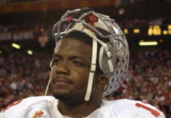 TEMPE, AZ - JANUARY 3:  Freshman running back Maurice Clarett #13 of the Ohio State Buckeyes takes in the BCS Championship victory over the University of Miami Hurricanes in the Tostitos Fiesta Bowl at Sun Devil Stadium on January 3, 2003  in Tempe, Arizona.  Ohio State won the game 31-24 in double-overtime, winning the NCAA National Championship.  (Photo by Brian Bahr/Getty Images)