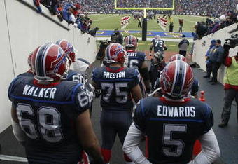 ORCHARD PARK, NY - DECEMBER 28:  Langston Walker #68, Duke Preston #75 and Trent Edwards #5 of the Buffalo Bills wait to walk on the field before the game against the New England Patriots on December 28, 2008 at Ralph Wilson Stadium in Orchard Park, New York. (Photo by Rick Stewart/Getty Images)