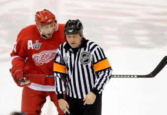 DETROIT - JUNE 02:  Pavel Datsyuk #13 of the Detroit Red Wings reacts to referee Dan O'Halloran during game five of the 2008 NHL Stanley Cup Finals against the Pittsburgh Penguins jat Joe Louis Arena on June 2, 2008 in Detroit, Michigan. The Penguins defeated the Red Wings 4-3 in triple overtime to set the series at 3-2 Red Wings.  (Photo by Jim McIsaac/Getty Images)