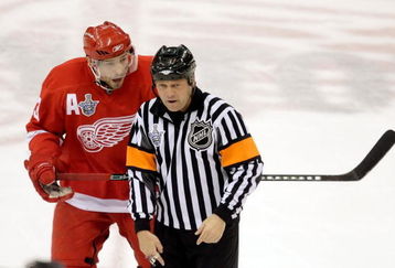 DETROIT - JUNE 02:  Pavel Datsyuk #13 of the Detroit Red Wings reacts to referee Dan O'Halloran during game five of the 2008 NHL Stanley Cup Finals against the Pittsburgh Penguins jat Joe Louis Arena on June 2, 2008 in Detroit, Michigan. The Penguins defeated the Red Wings 4-3 in triple overtime to set the series at 3-2 Red Wings.  (Photo by Jim McIsaac/Getty Images)
