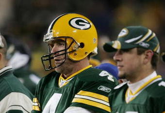 GREEN BAY, WI - NOVEMBER 6:  Quarterbacks Brett Favre #4 and Aaron Rodgers #12 of the Green Bay Packers watch the final minutes of a game against the Pittsburgh Steelers from the sideline November 6, 2005 at Lambeau Field in Green Bay, Wisconsin. The Steelers defeated the Packers, 20-10.  (Photo by Jonathan Daniel/Getty Images)