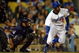 LOS ANGELES, CA - MAY 01: Juan Pierre #9 of the Los Angeles Dodgers hits a single against the San Diego Padres in the third inning at Dodger Stadium on May 1, 2009 in Los Angeles, California. The Dodgers defeated the Padres 1-0. (Photo by Jeff Gross/Getty Images)