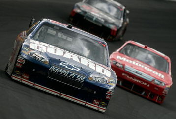 CONCORD, NC - MAY 25:  Dale Earnhardt Jr., driver of the #88 National Guard/AMP Energy Chevrolet, races Bill Elliott, driver of the #21 Motorcraft Ford, during the NASCAR Sprint Cup Series Coca-Cola 600 on May 25, 2009 at Lowe's Motor Speedway in Concord, North Carolina.  (Photo by Streeter Lecka/Getty Images)
