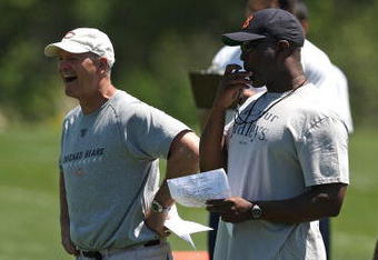 LAKE FOREST, IL - MAY 20: Head coach Lovie Smith of the Chicago Bears (R) and defensive line coach Rod Marinelli watch an organized team activity (OTA) practice on May 20, 2009 at Halas Hall in Lake Forest, Illinois. (Photo by Jonathan Daniel/Getty Images)