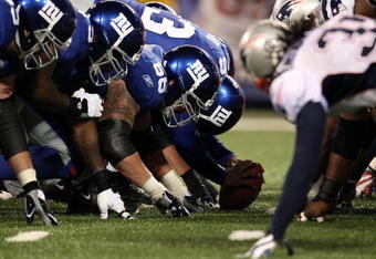 EAST RUTHERFORD, NJ - DECEMBER 29:  The New England Patriots line up against of the New York Giants on December 29, 2007 at Giants Stadium in East Rutherford, New Jersey.  (Photo by Al Bello/Getty Images)