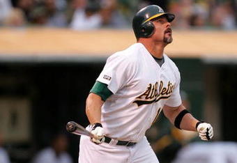 OAKLAND, CA - MAY 23:  Jason Giambi #16 of the Oakland Athletics watches his 400th career home run go over the outfield wall in the fourth inning of their game against the Arizona Diamondbacks at the Oakland Coliseum on May 23, 2009 in Oakland, California.  (Photo by Ezra Shaw/Getty Images)