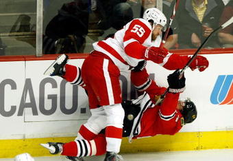 CHICAGO - MAY 22:  Martin Havlat #24 of the Chicago Blackhawks checked hard to the ice by Niklas Kronwall #55 of the Detroit Red Wings during the first period of Game Three of the Western Conference Championship Round of the 2009 Stanley Cup Playoffs on May 22, 2009 at the United Center in Chicago, Illinois.  (Photo by Jim Prisching/Getty Images)
