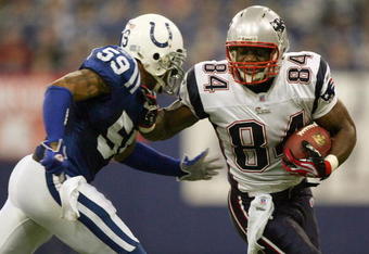 INDIANAPOLIS - JANUARY 21:  Benjamin Watson #84 of the New England Patriots tries to get past Cato June #59 of the Indianapolis Colts during the AFC Championship Game on January 21, 2007 at the RCA Dome in Indianapolis, Indiana.  (Photo by Jed Jacobsohn/Getty Images)