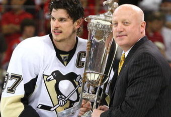RALEIGH, NC - MAY 26:  Sidney Crosby #87 of the Pittsburgh Penguins accepts the Prince of Wales trophy from Deputy Commissioner of the NHL Bill Daly after their 4-1 win over the Carolina Hurricanes in Game Four of the Eastern Conference Championship Round of the 2009 Stanley Cup Playoffs at RBC Center on May 26, 2009 in Raleigh, North Carolina.  (Photo by Jim McIsaac/Getty Images)