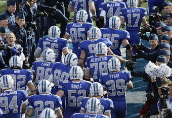 AIR FORCE ACADEMY, CO - NOVEMBER 11: The Air Force Falcons runs onto the field before the game against the Notre Dame Fighting Irish on November 11, 2006 at Falcon Stadium on the Air Force Academy near Colorado Springs, Colorado.  (Photo by Brian Bahr/Getty Images)