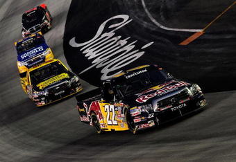 BRISTOL, TN - AUGUST 20:  Scott Speed, driver of the #22 Red Bull Toyota leads a group of trucks during the NASCAR Craftsman Truck Series O'Reilly 200 at Bristol Motor Speedway on August 20, 2008 in Bristol, Tennesse.  (Photo by Rusty Jarrett/Getty Images for NASCAR)